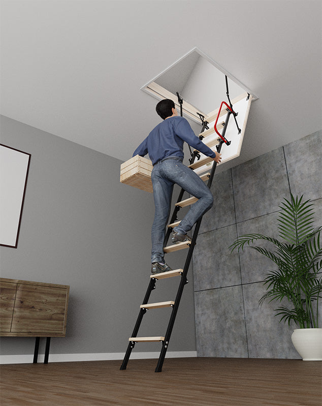 Man climbing up on the UNI metal-wooden attic stairs 31.5 x 31.5